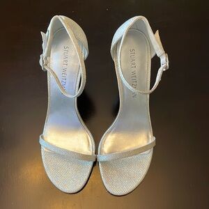Stuart Weitzman size 8 strappy heels. Never been worn. Color, silver.